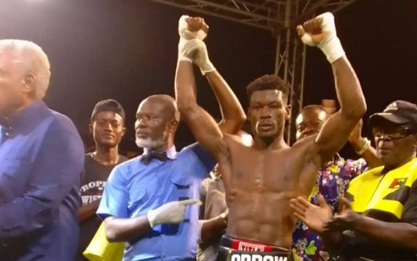 Allotey's right hand being lifted by referee Roger Barnor as the new WBO African Super welter weight champion